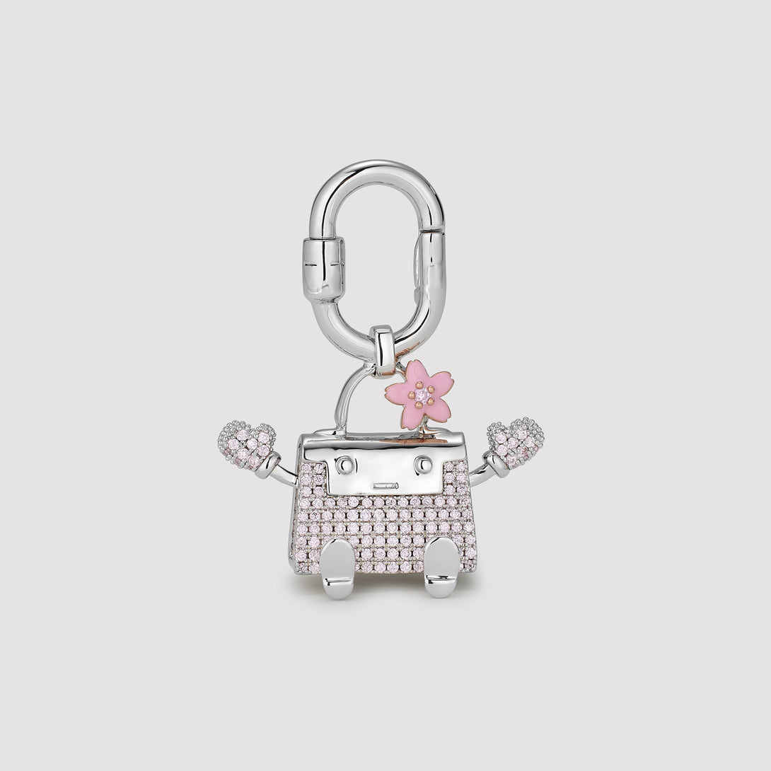 Kelly Doll Bag Charm with Floral details and pink pave stones in silver color