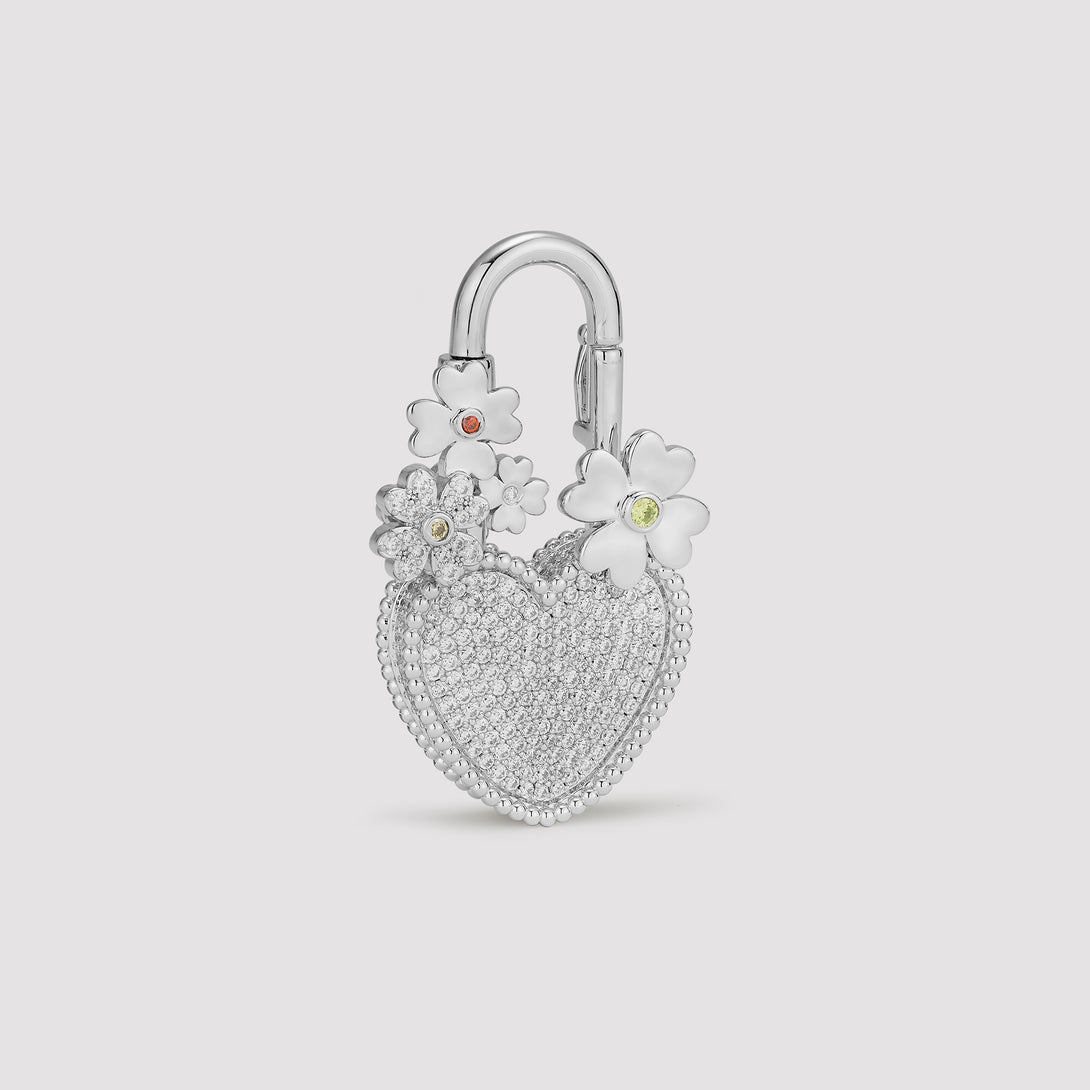 Silver pave stone heart-shaped padlock with floral designs on a light gray background