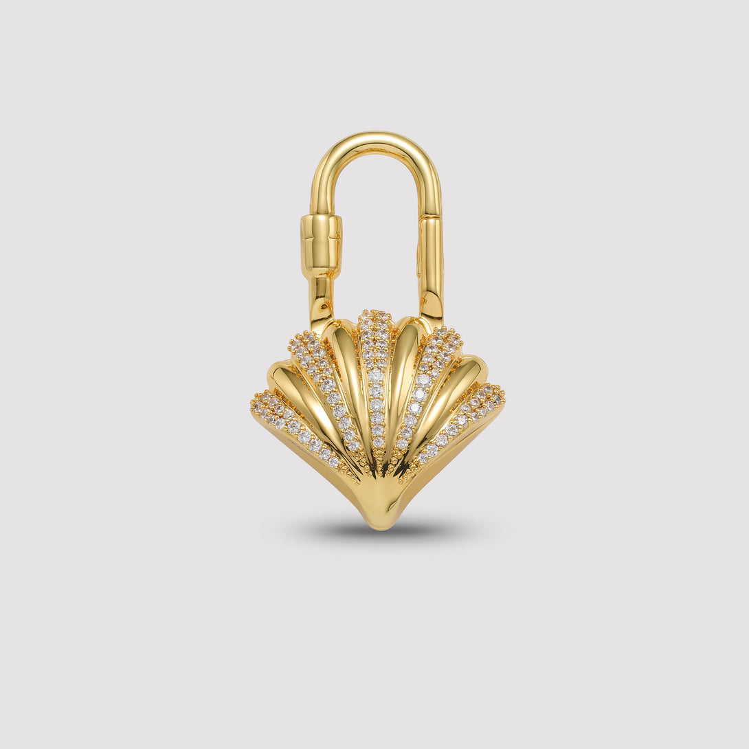 Charmante Gold lock with shell design on a light gray background