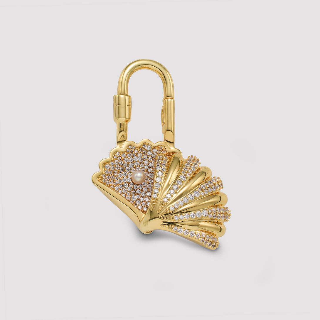 Charmante Gold lock with shell open design on a light gray background