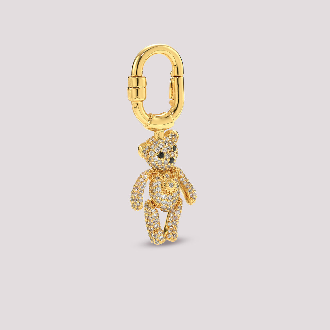 Gold Side Charmante teddy bear charm on a light gray background
