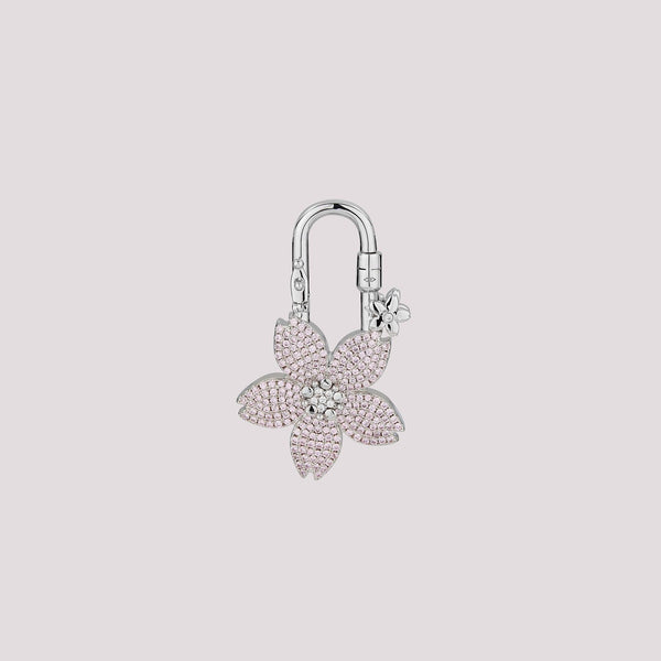 The pavé sakura design features two colors in one charm—white crystals on the front and pink crystals on the back. It’s perfect for those who love options without the need to splurge on two! A stunning accessory designed to elevate your Hermès collection or any high-end handbag.