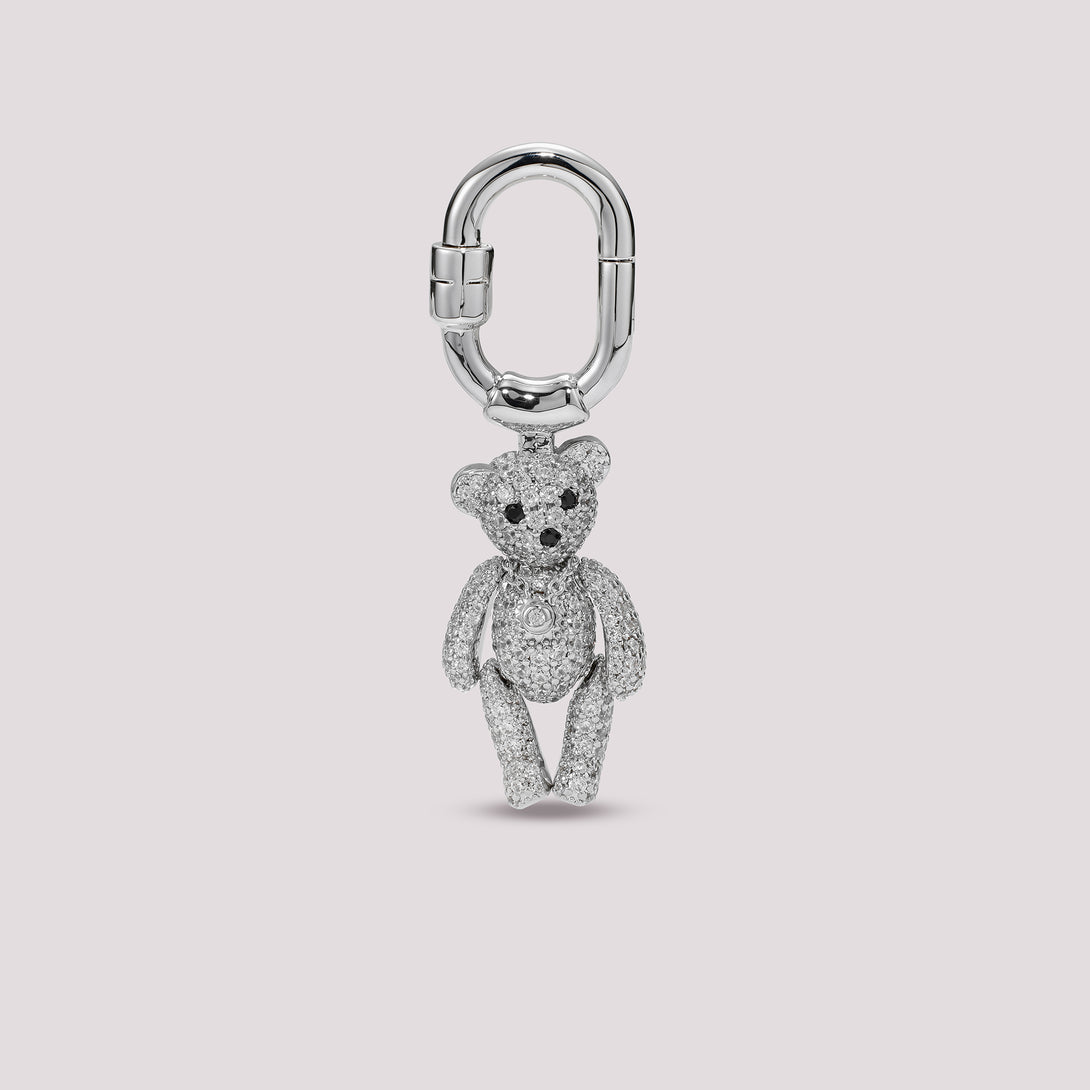 Silver Charmante teddy bear charm on a light gray background