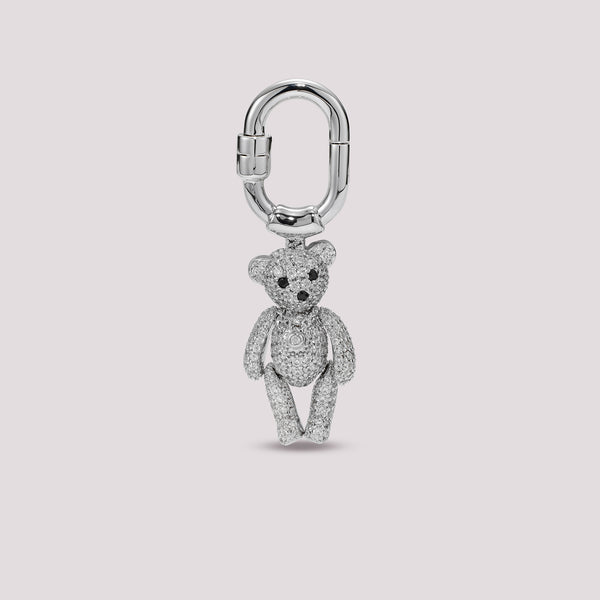 Silver Charmante teddy bear charm on a light gray background