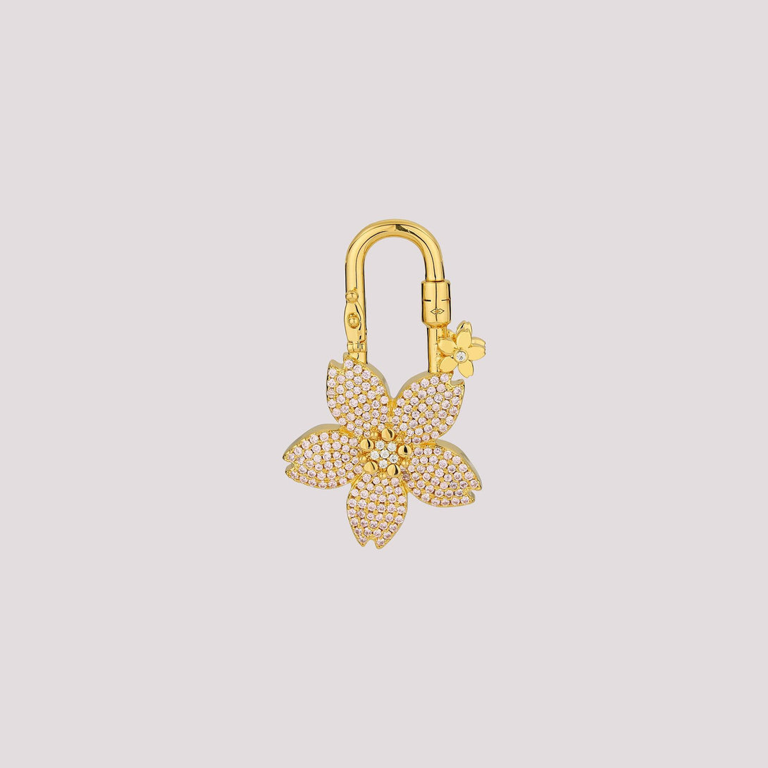 The pavé cherry blossom design features two colors in one charm—white crystals on the front and pink crystals on the back. It’s perfect for those who love options without the need to splurge on two! A stunning accessory designed to elevate your Hermès collection or any high-end handbag.