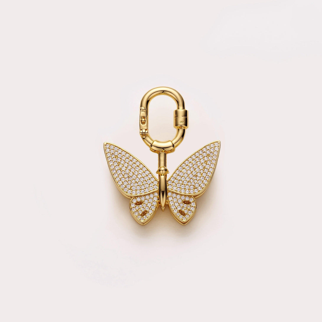 Handcrafted gold butterfly bag charm made with gold plated metal and zirconia stones, adding elegance to hermes handbags