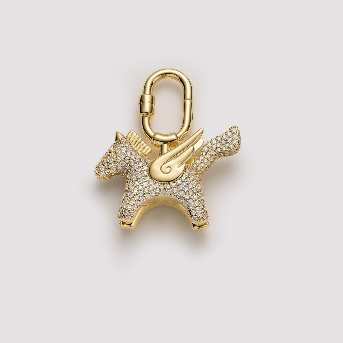 Gold pavé Pegasus bag charm, handcrafted with intricate detailing and designed for Hermès and luxury handbags. A premium accessory to elevate high-end bag collections.