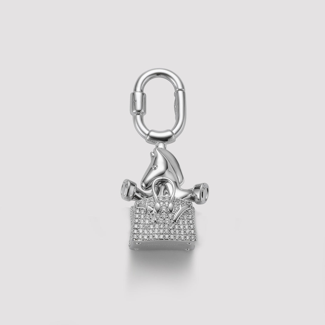 Pony in the Birkin bag charm, handcrafted with silver finish, designed to complement luxury handbags like Hermès. A unique and elegant accessory for high-end bag collections.